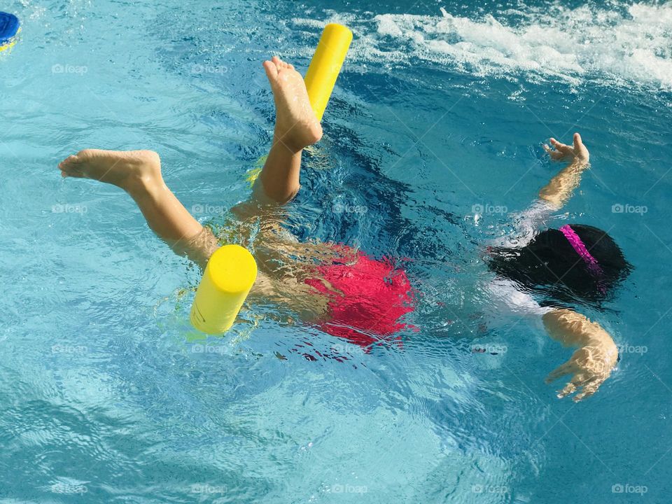  A Girl swimming in the pool .