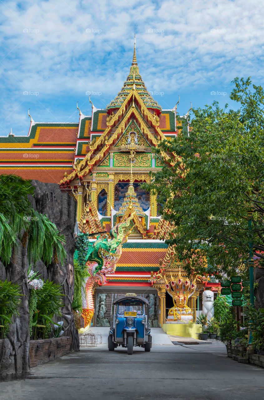 Beautiful Thai church with TukTuk scene