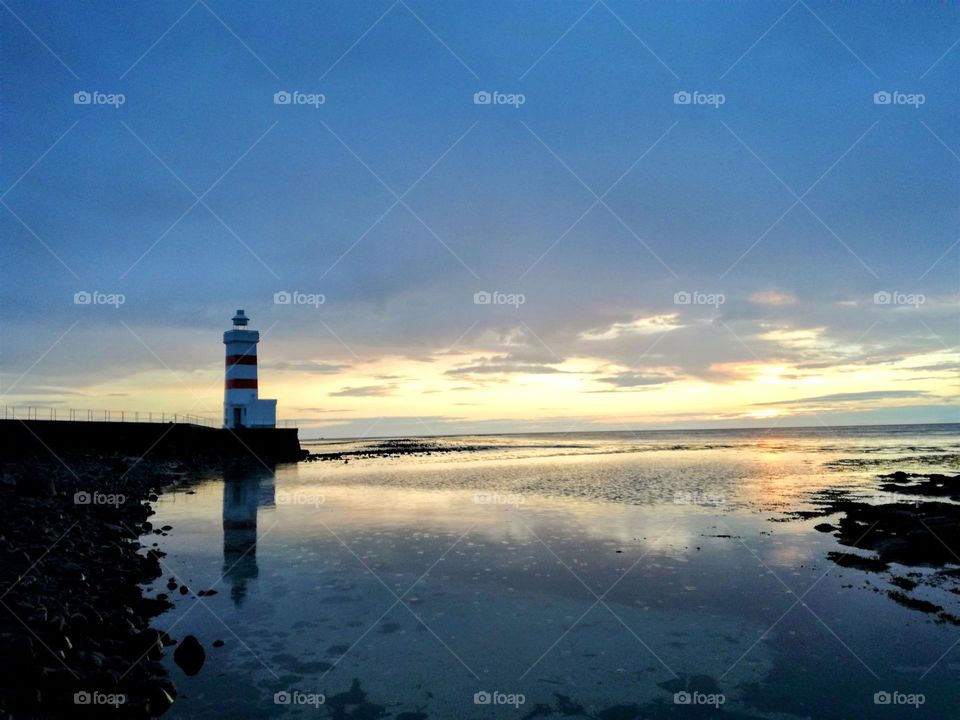 The reflection of the lighthouse