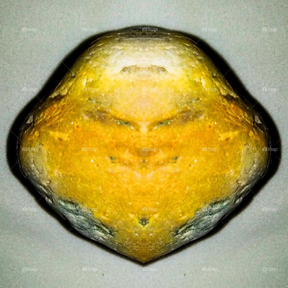 Golden Face of stone