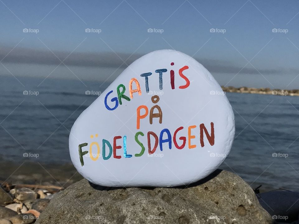 Grattis På Födelsdagen, Happy Birthday in swedish language carved and colored on a stone