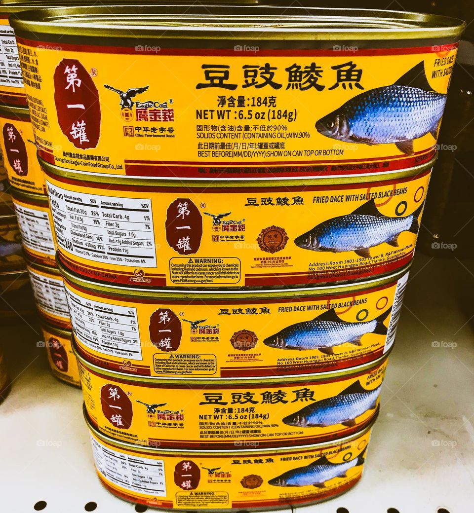 Canned fried fishes at the supermarket.