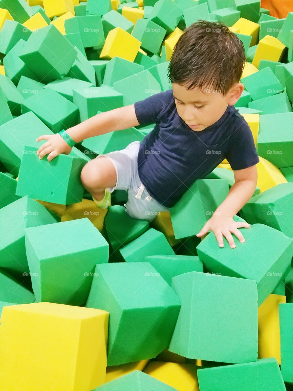 Boy playing with colorful cube