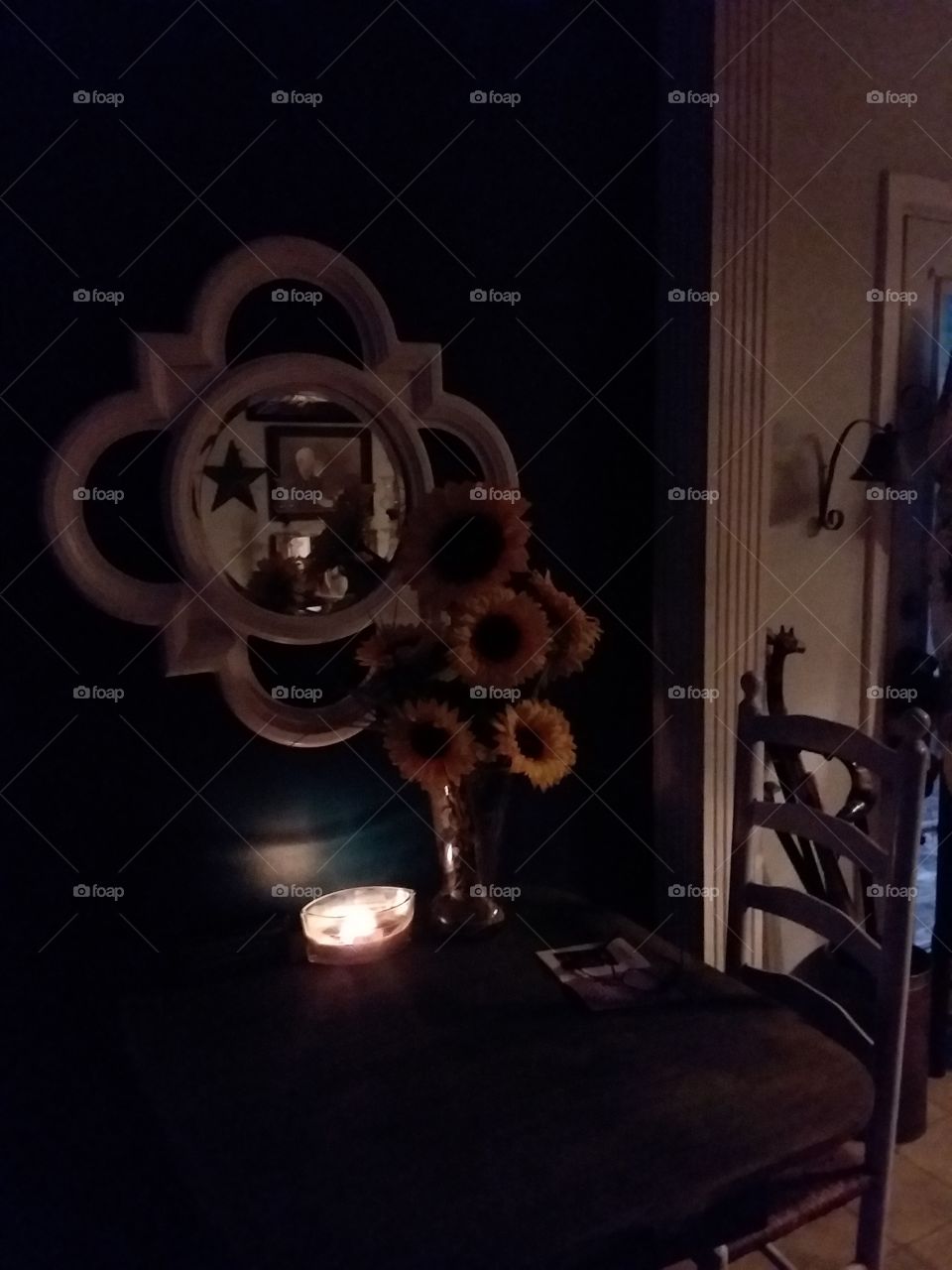 soft glow of candlelight reflections in the mirror old ladder back chair