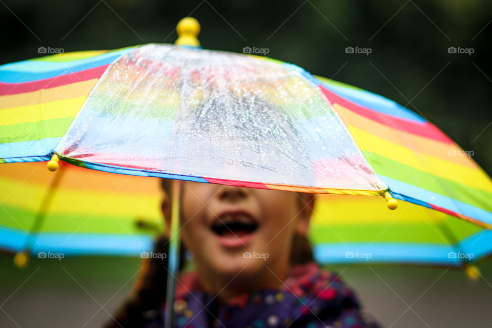 Cute little girl with colorful umbrella