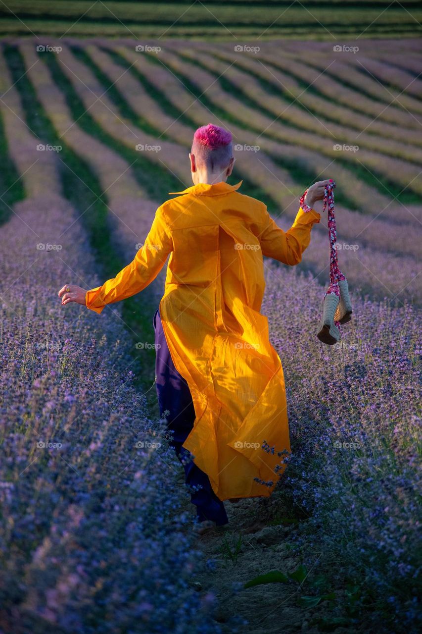 Pink Haired Woman runs in Lavender Field
