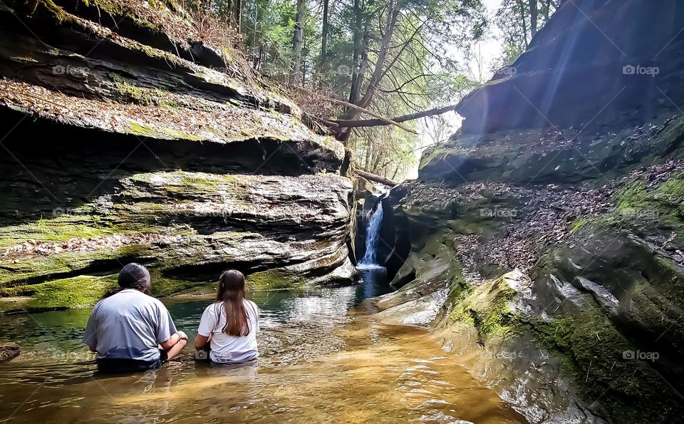 Enjoying the waterfall at Corkscrew Robinson Falls in Hocking Hills