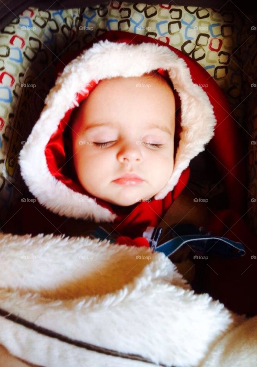 Bundled up. Baby sleeping bundled in her winter coat 