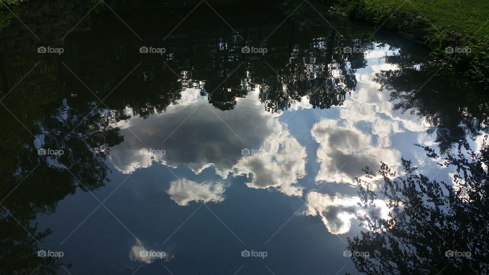 clouds floating  on water