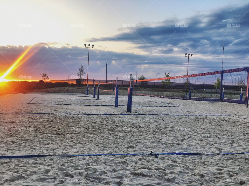 Beach volleyball court in the evening at sunset 