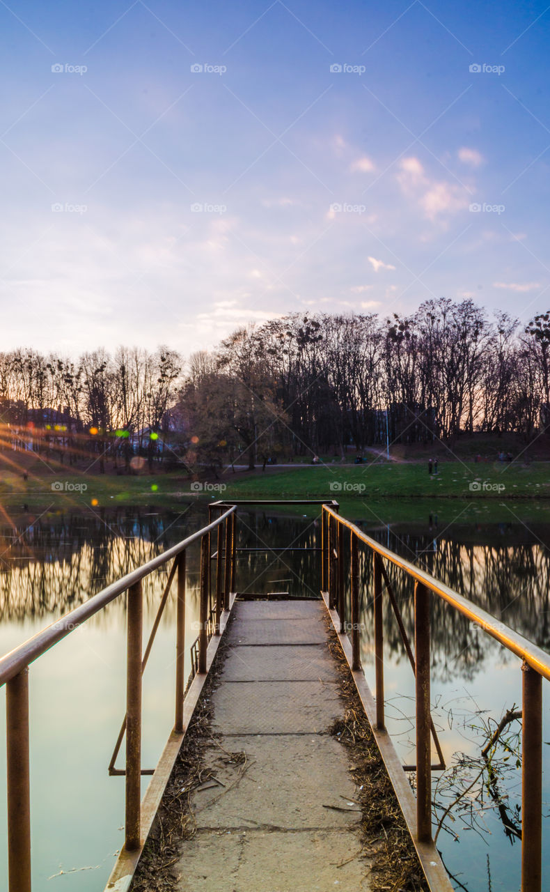 city park with lake in the spring season