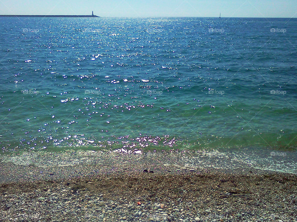 lighthouse, sea and beach