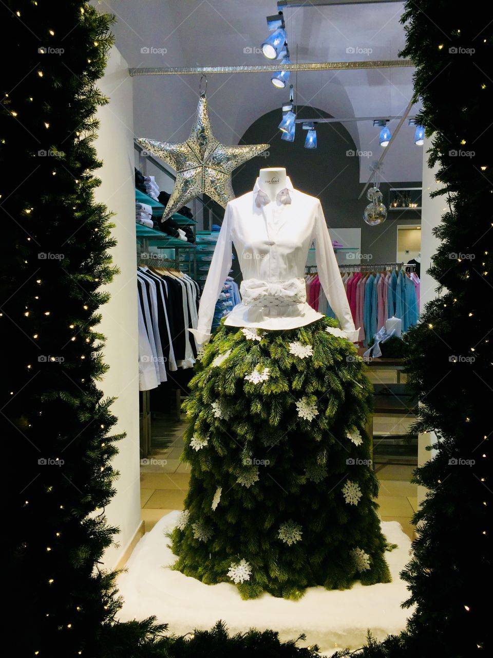 Winter fashion on a mannequin consisting of skirt made of branches in a shop