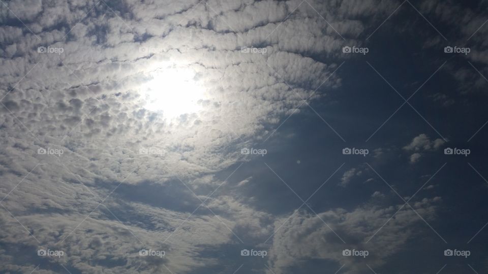 Wispy clouds & sun