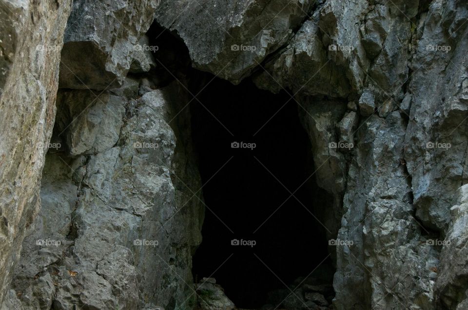 Entrance to the cave. Dark. Hole
