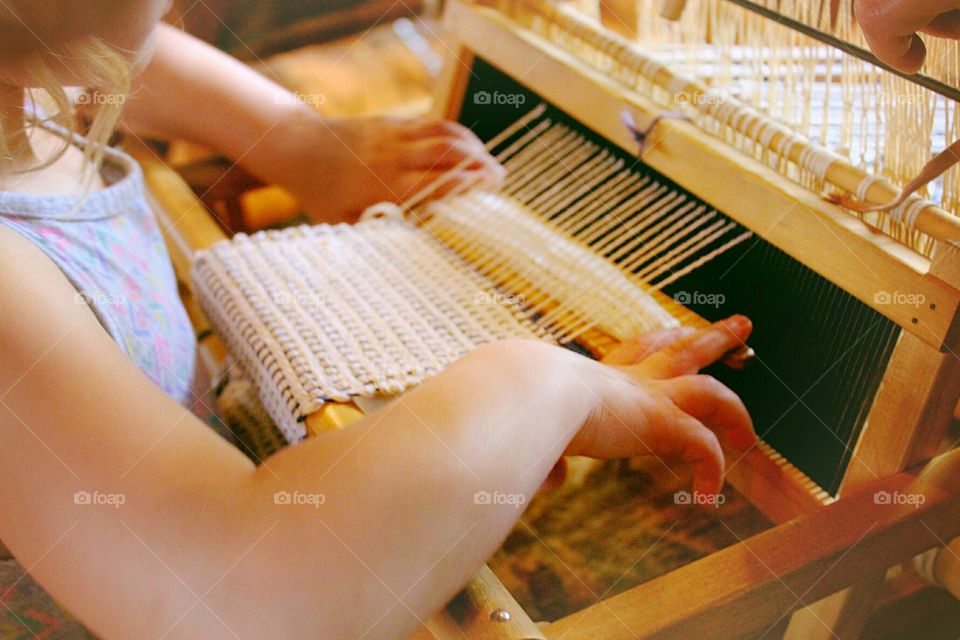 Being taught to Weave at a museum