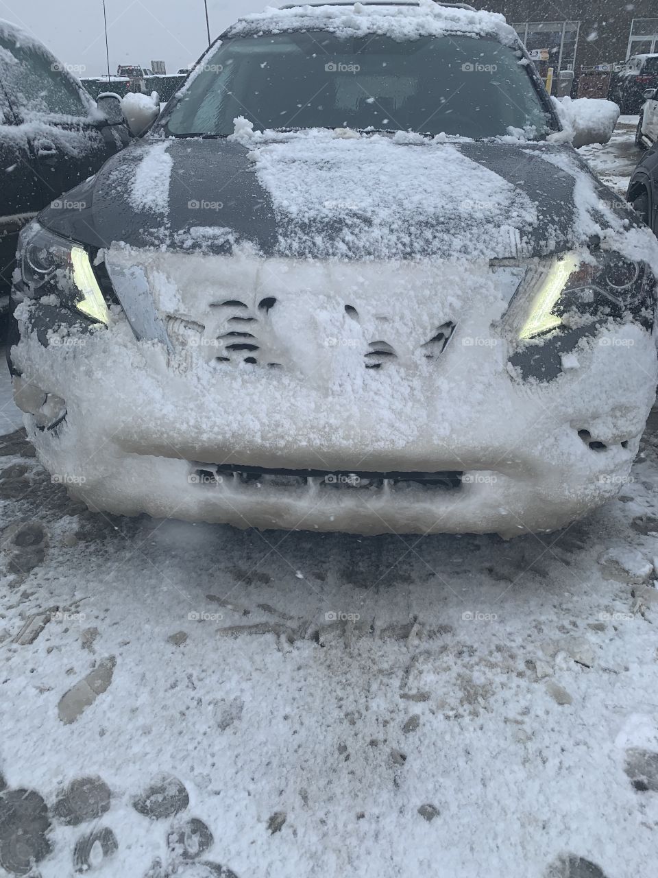 Car after driving through a snow storm 
