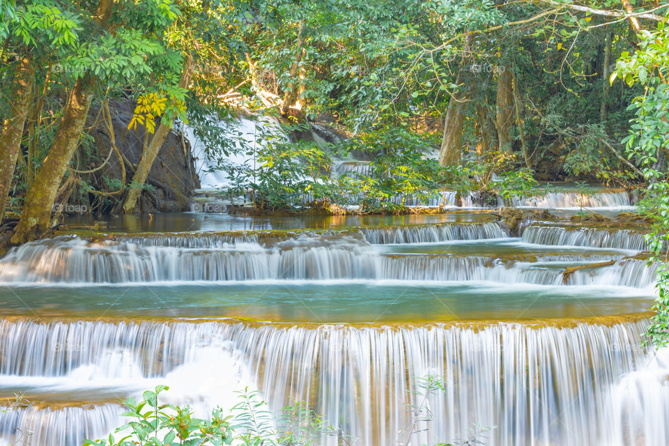 Waterfall flowing from the mountains at Huay Mae khamin waterfall National Park ,Kanchana buri in Thailand.