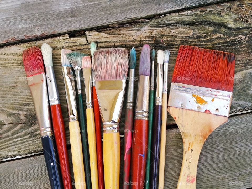 Arrangement of paint brush on table