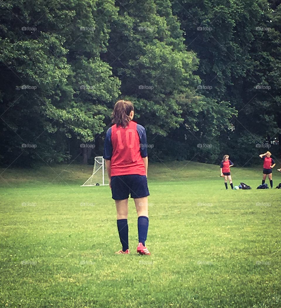 Quiet moment on the soccer field - a brief moment to rest while the ball is on the other side of the field. 