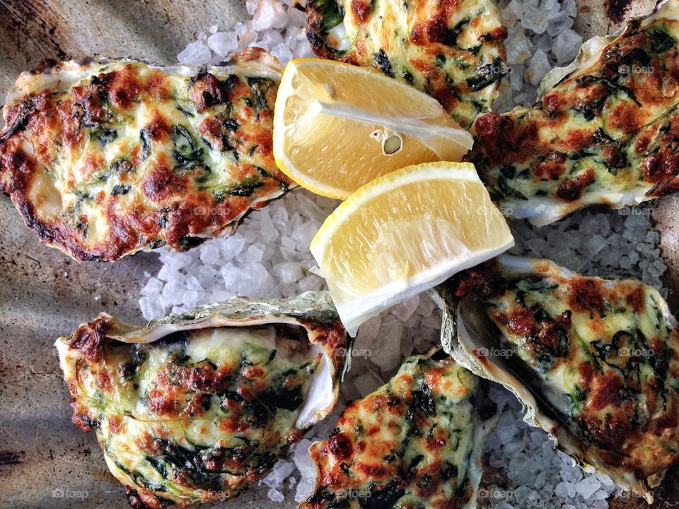 Oysters Rockefeller.  Rockefeller oysters filled with spinach, fontina cheese, oyster juice and lemon if wanting to add on to it. 