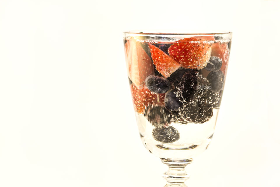 Mixed berries in bubbly water