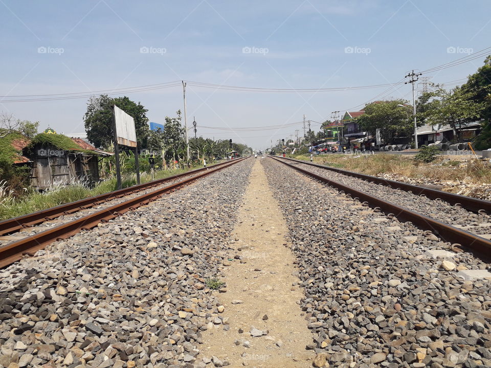 RAILROAD TRACKS IN RURAL AREAS. Photo was taken in Cetral Java, Indonesia, on October 21, 2019.