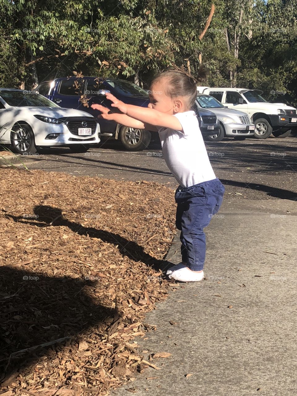 Grandson playing with bark 