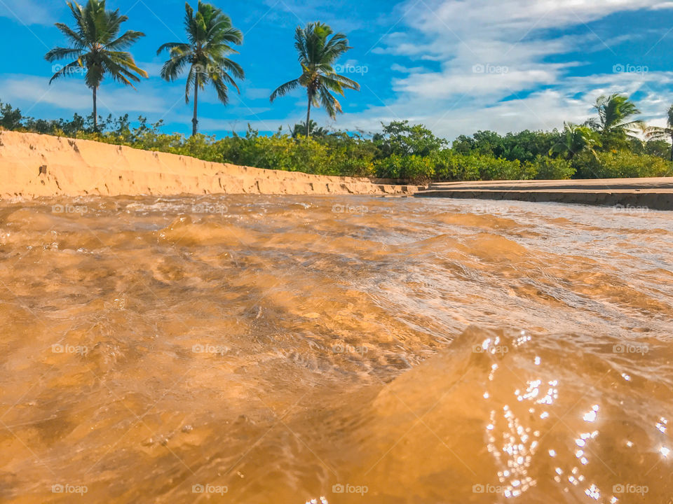 Fresh water river, flowing into the sea and a beautiful view, tropical paradise Brazil