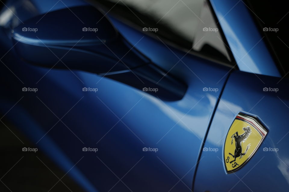 close up logo of Ferrari 488 spider blue coupe sports car, 3.9 liter V8 twin turbocharged produced by the Italian sports car - Ferrari F154CB V8