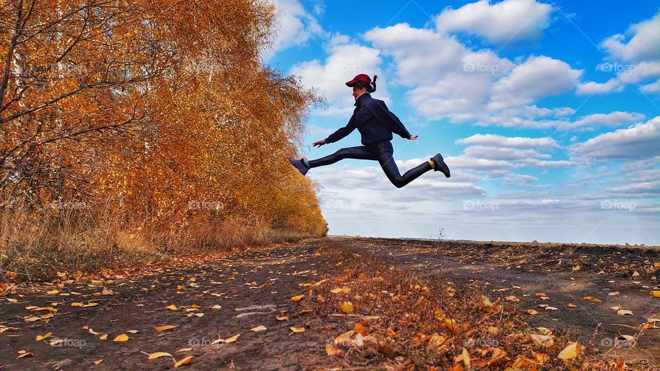 A beautiful autumn atmosphere, a long road and a beautiful birch grove