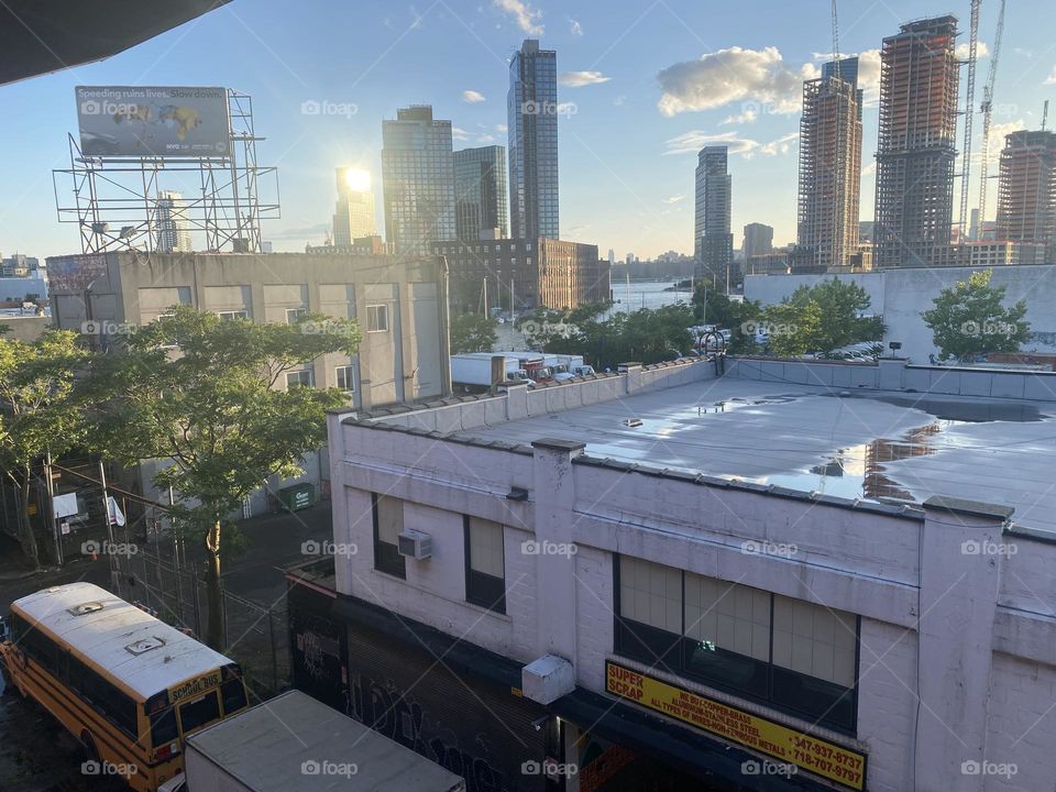 “Long Island City” and in the furthest distance behind it parts of “Manhattan” can be seen while descending from the “Pulaski Bridge”. 2023. Hypnotic Productions