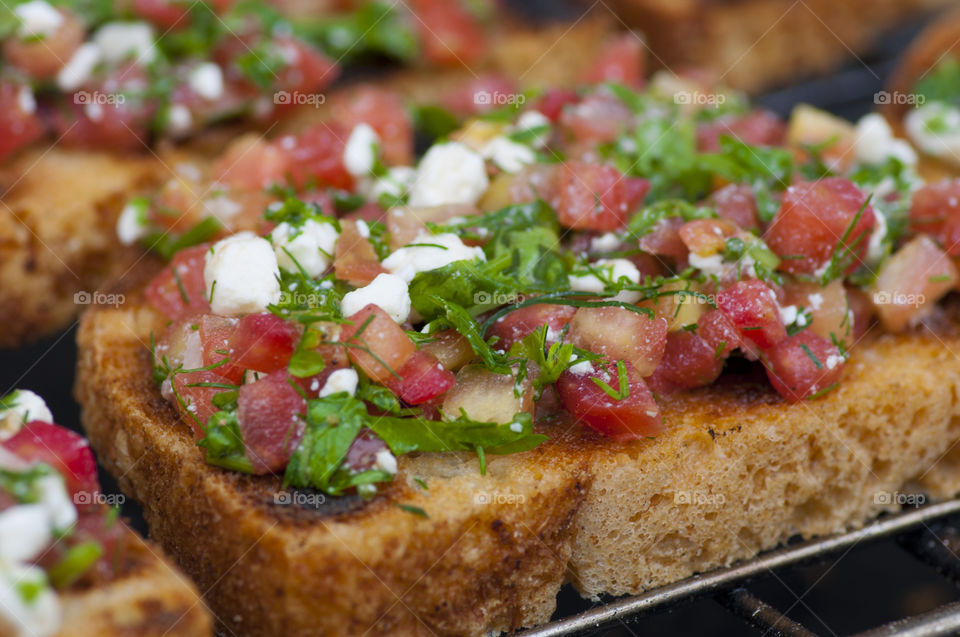 Bruschetta. Bruschetta with tomato, basil, feta and garlic