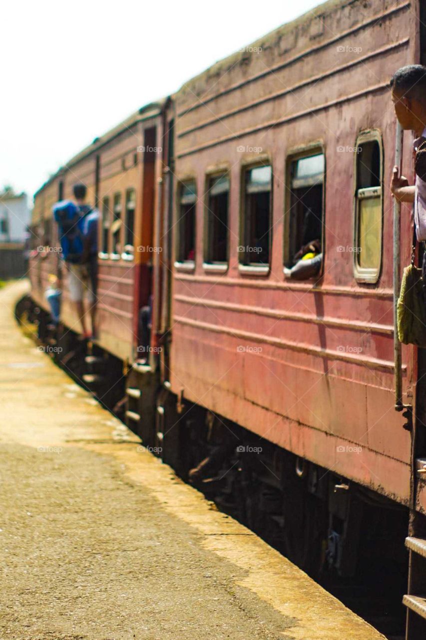 Hanging outside the train