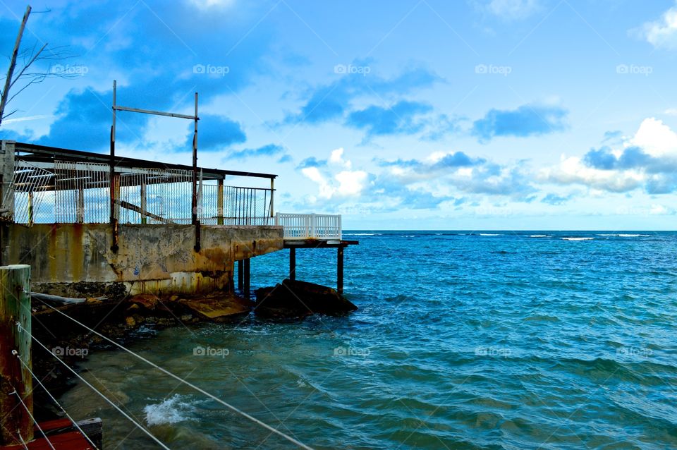 Ocean . View from the dock of the ocean in Puerto Rico. Abandoned building. 