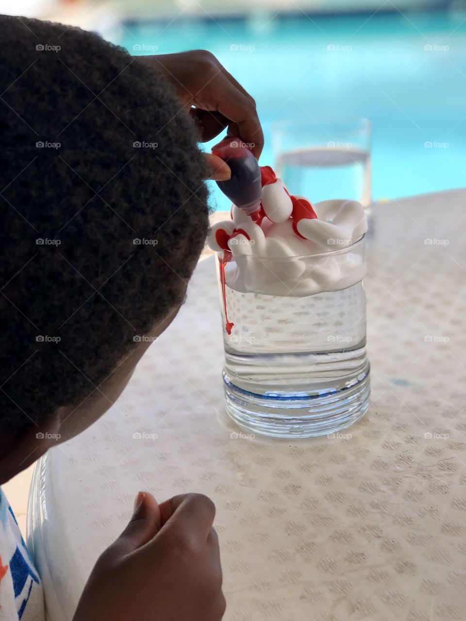 Child doing a science experiment 