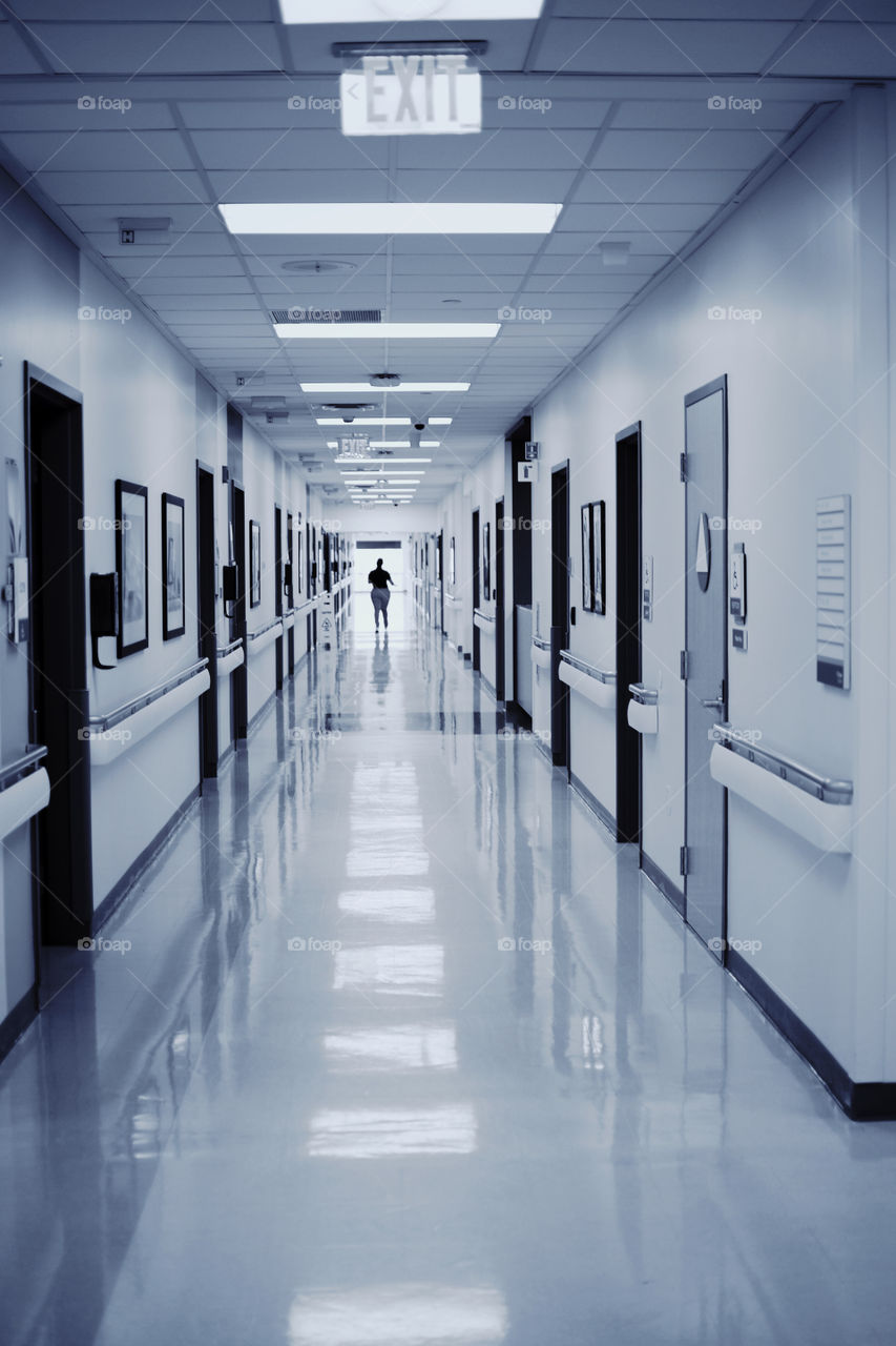 Clean Hallway with person at the end in Black and White 