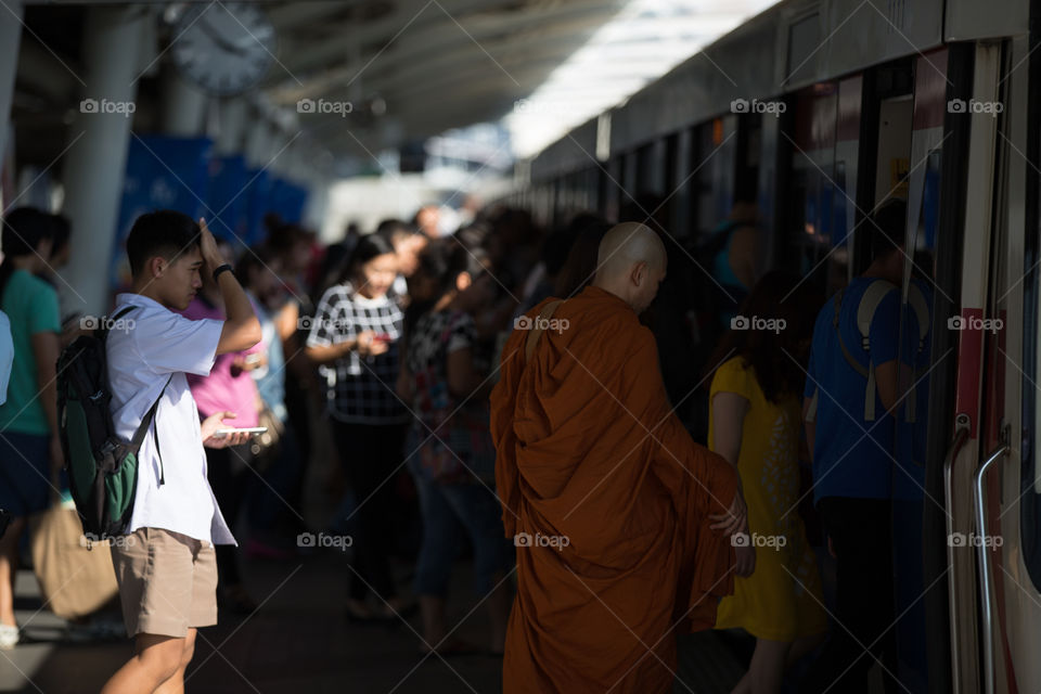 Monk in BTS public train station 