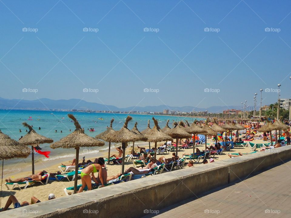 Cool beach. Cool beach with umbrella Made of straws