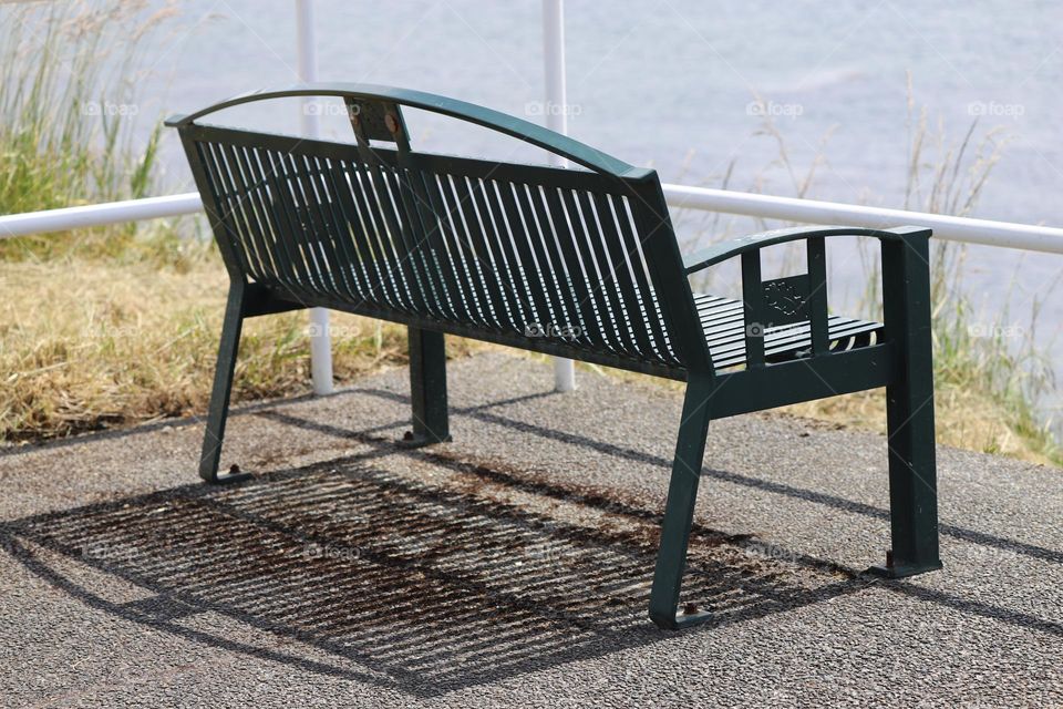 Bench casting shadow on the ground 