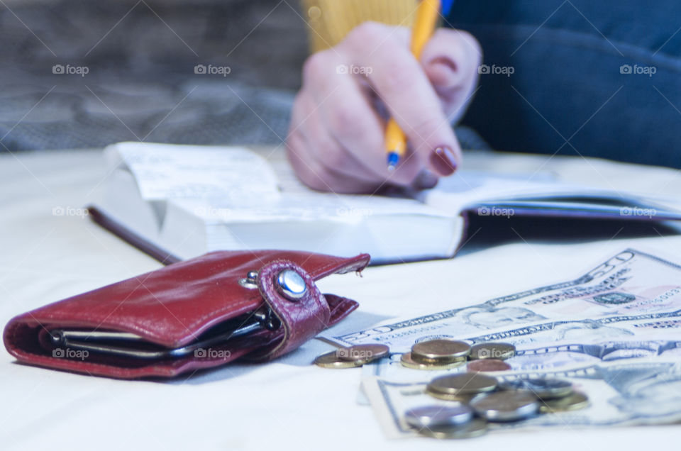 woman takes notes in notepad and says Finance