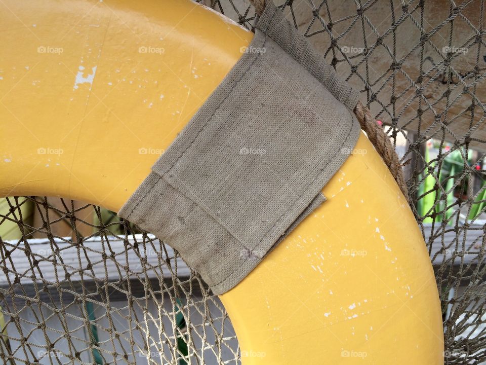 Beach scene with life ring and netting