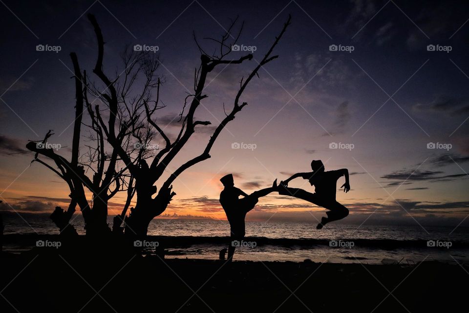 silhouette of practicing karate
