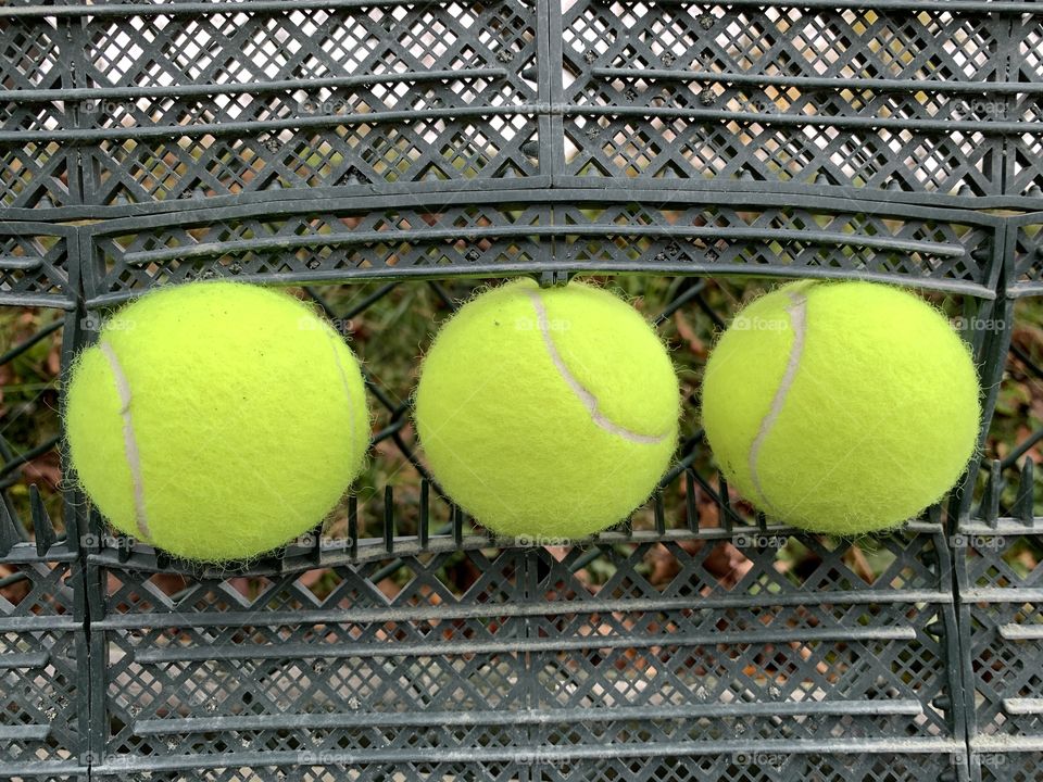 Three tennis ball stuck in the sweeper equipment.