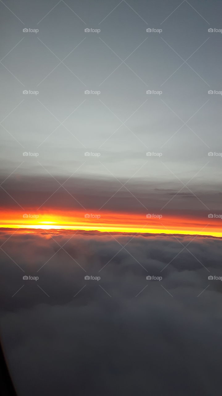 beautiful sunrise view from an airplane in flight