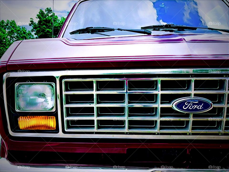 Ford Econoline Van, front grill of a Ford, Ford emblem on the front grill of a car, reflections on a car windshield, classic car from the 90’s, closeup of a van, parts of a car