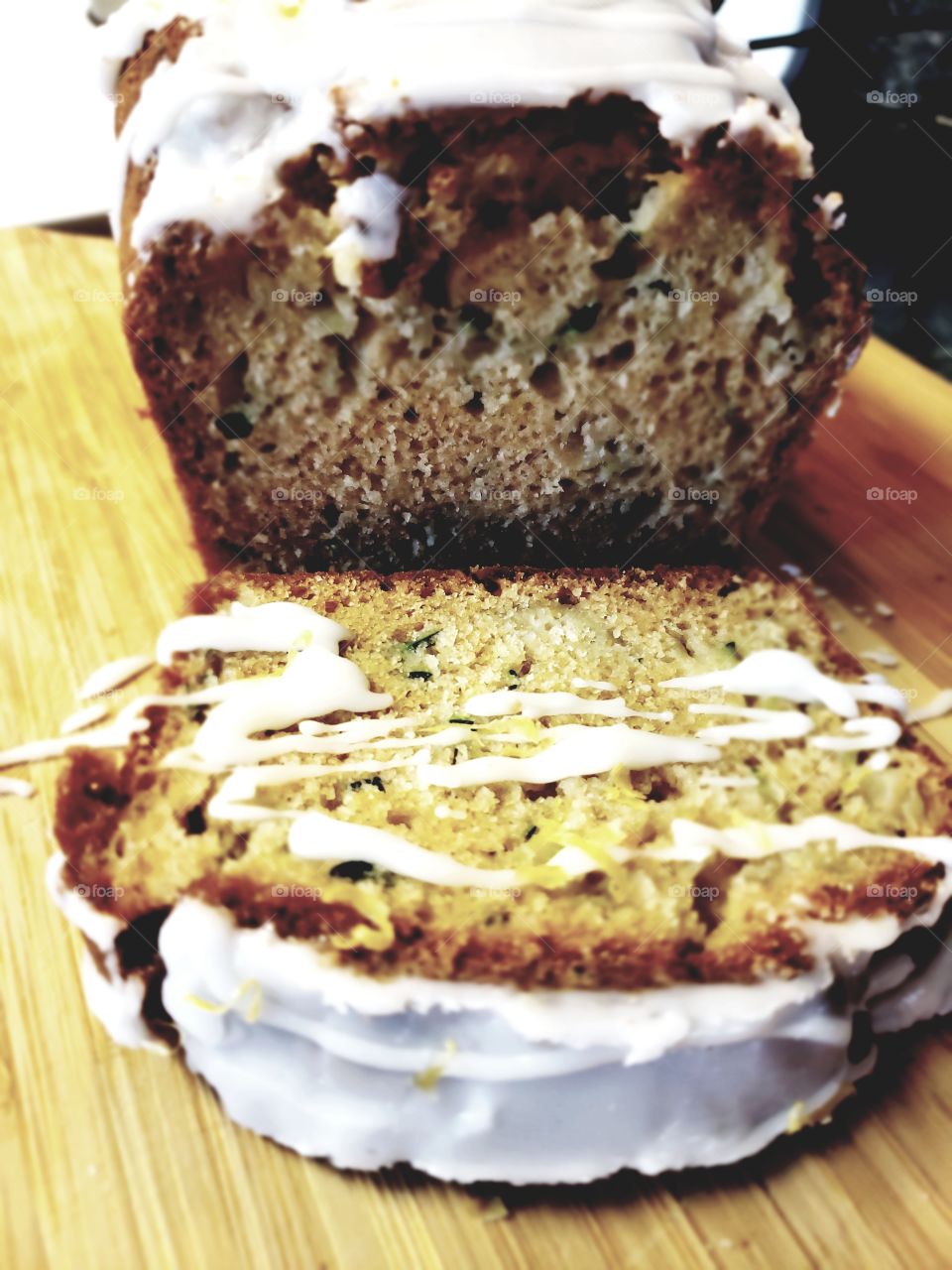 Delicious bread made from freshly harvested zucchini out of the garden with lemon drizzle. 