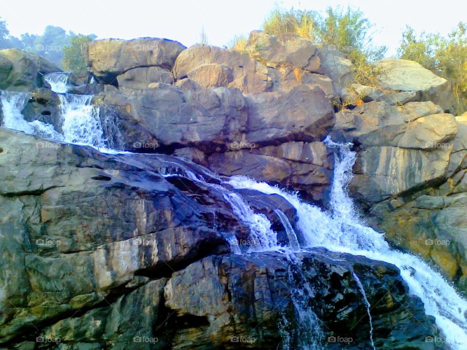 Waterfall on rocks the beautiful landscape