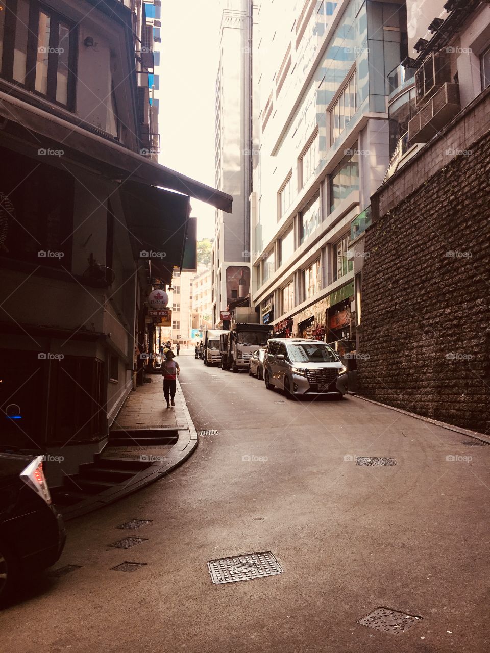 Streets of Hong Kong. Amazing place filled w wealth, business, luxury, and modernization, but also holding on tight to history, culture, and grit. Hidden back alley here 