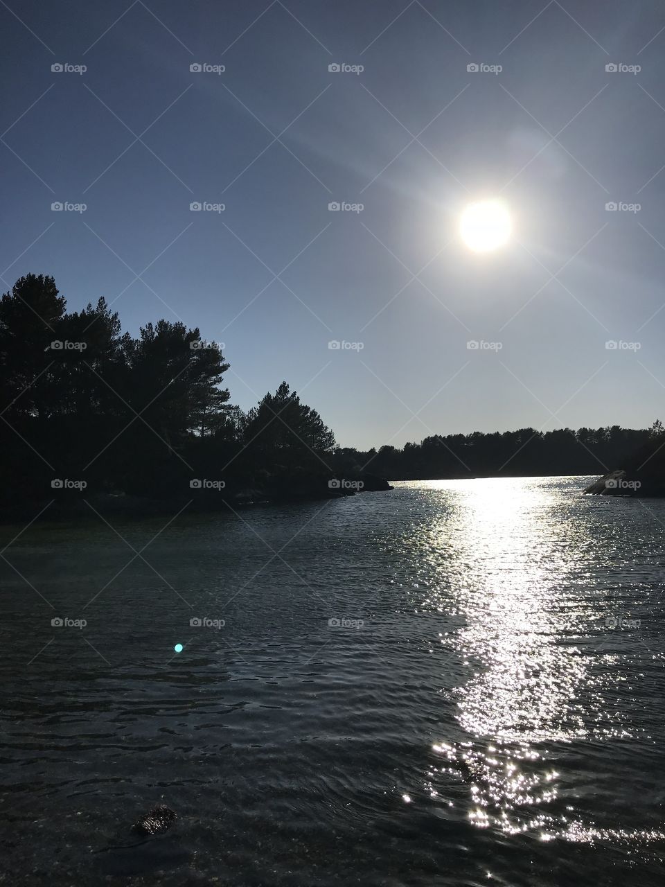 Sun reflecting in the sea in Norway. Good, warm weather.                          